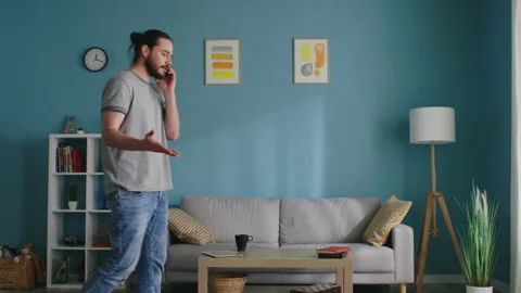 Young Man Is Talking on the Phone Stock Footage 136290909