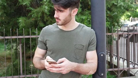 Young man talking phone at street Stock Footage