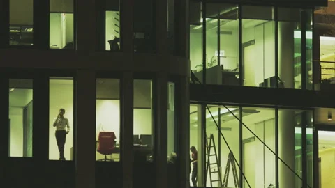 Young Man Talking on the Phone in Tall Office Building Stock Footage 87804403