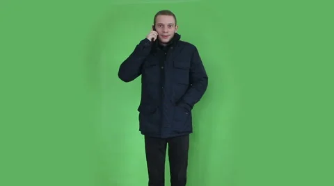 Young man talking at phone winter time Stock Footage 45696410