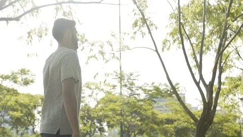 Young man talking on smartphone Stock Footage 106316380