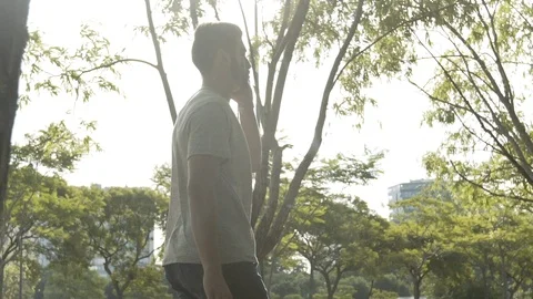 Young man talking on smartphone Stock Footage 106316409