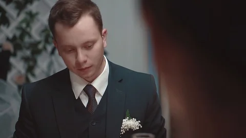 Young man talking while sitting at a table in a restaurant, close-up Stock Footage 105092572