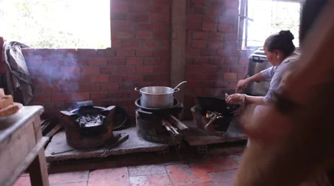 Young man talks about Vietnamese soup while woman cooks in background Stock Footage 61070493