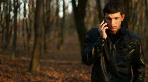 Young Man Talks by phone Video stock 33008788