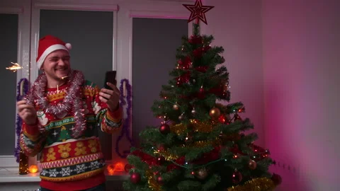 A young man talks by video link and tells his family about himself Stock Footage 166237655