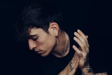 Young man with tattoos clapping the hands Stock Photos