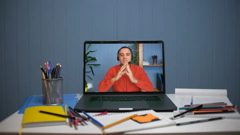 A young man teaches online through video communication. Online courses and Stock Footage 147408967