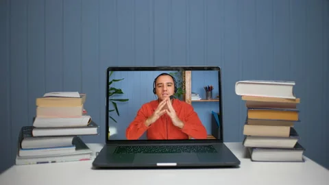 A young man teaches online through video communication. Online courses Stock Footage 155297502