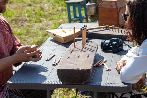 Young Man Teaching Folk Game at Outdoor Festival Stock Photos