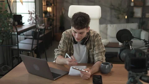 Young man technology blogger prepare for new video for new gadget Stock Footage 292564538