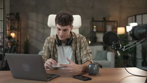 Young man technology blogger prepare for new video for new gadget Stock Footage 292564578