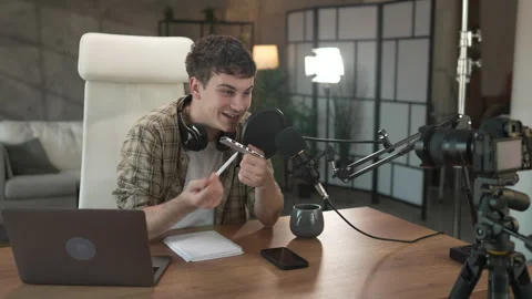 Young man technology blogger record video blog or v-log of new gadget Stock Footage 292562551