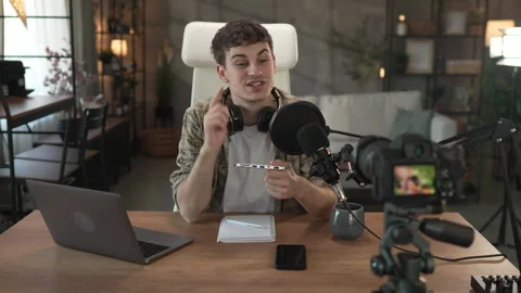 Young man technology blogger record video blog or v-log of new gadget Stock Footage 292562627