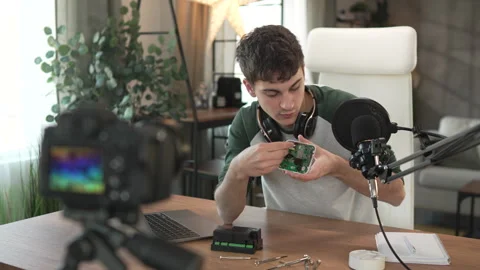 Young man technology blogger record video blog or v-log set up device Stock Footage 292563516