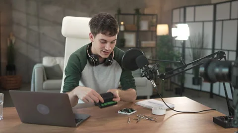 Young man technology blogger record video blog or v-log set up device Stock Footage 292563602