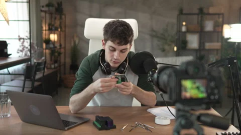 Young man technology blogger record video blog or v-log set up device Stock Footage 292563632