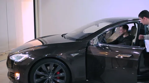 Young man testing the electric car Stock Footage 68191235