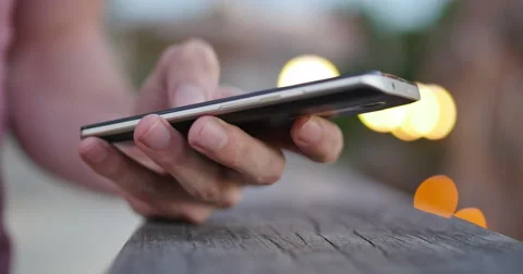 Young Man Texting and Leaning on Bridge City Lights Close Up, 4K Stock Footage 65145337