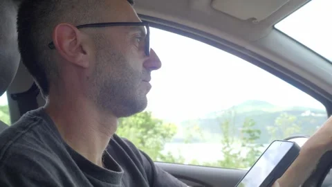 Young Man Texting on Smartphone While Driving, Dangerous Road Behavior Stock-Footage 335701881