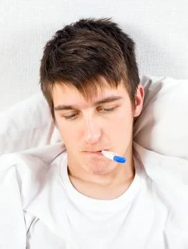 Young Man with a Thermometer Stock Photos