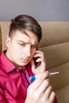 Young Man with a Thermometer Foto stock