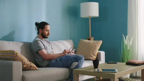 Young Man Is Thinking about Drawing Concept Stock Footage 132432857