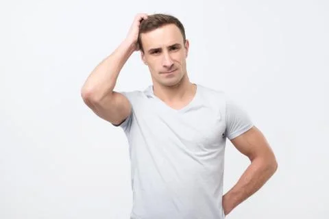Young man thinking about problem. Negative emotion Stock Photos