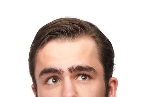 Young man thinking and looking up Stock Photos