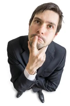 Young man is thinking and looking at you. View from above Stock Photos
