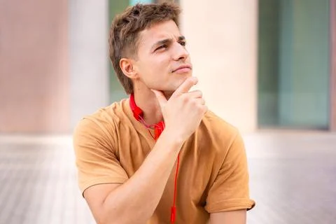 Young Man Thinking and Looking to the Side.Vertical Stock-Fotos