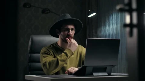 Young man thinking have an ideas sitting at desk in living room.Inspiration guy Stock Footage 232134225
