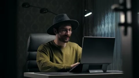 Young man thinking have an ideas sitting at desk in living room.Inspiration guy Stock Footage 232134472