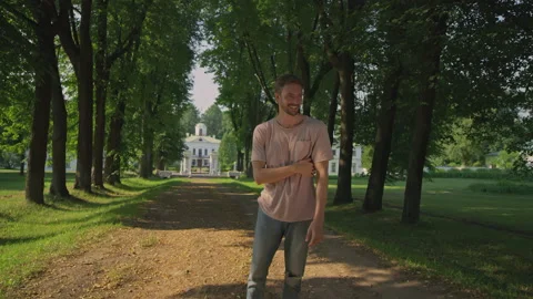 The young man is thinking in the park.Red Helium 8K Stock Footage 156327635