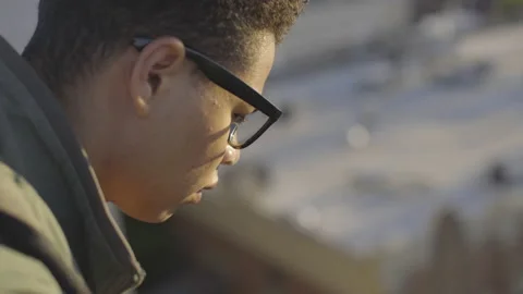 Young Man Thinking on Top of Building Vídeos de archivo 208710330