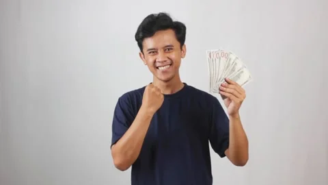 Young man thoughtfully considering financial decisions Stock Footage 318453638