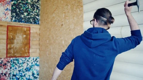 Young man is throwing axes at the target 스톡 동영상 81924066
