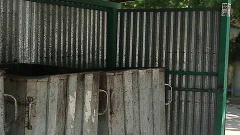 Young man is throwing out the garbage in the waste container Slow motion Stock Footage 75983313