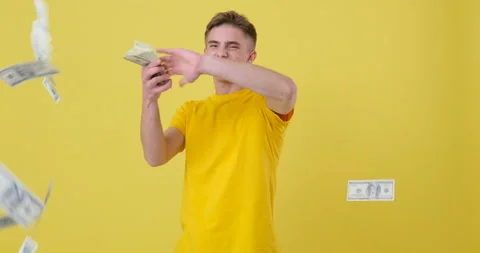 Young Man throwing out money banknotes in slow motion Stock Footage 144959629
