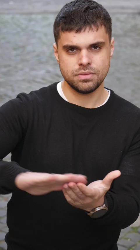 Young man throws money gesture with hands acting like a boastful person Stock Footage 328644540