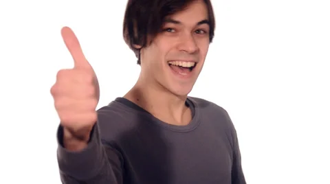 Young man with thumbs up on white Stock Footage 29994694