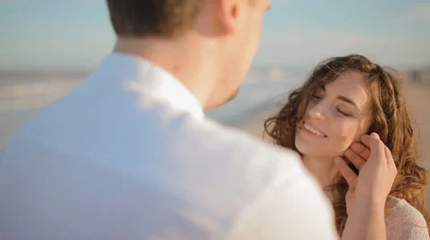 Young man touch face of his woman Stock Footage 61652910