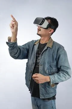 Young man touching the air during the VR experience Stock Photos