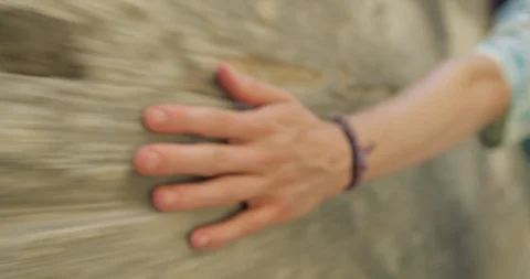Young Man Touching Stone Wall in  Spanish Old Town Street,  Stock Footage 94429909