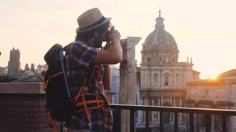 Young man tourist backpacker taking pictures with vintage camera at Roman Forum Stock-Footage 117364386