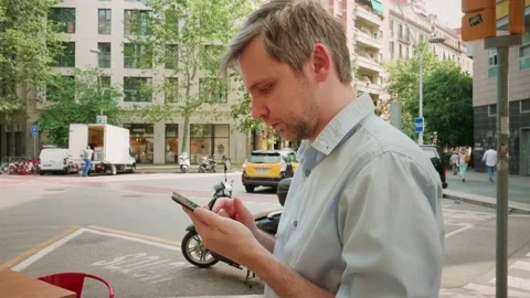Young man tourist using smartphone close-up, businessman writing message in Stock Footage 197079731
