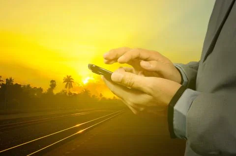 Young man in train station using cellphone (mobile) Stock Photos