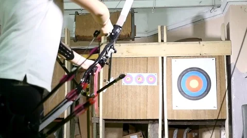 Young man training at archery with bow and arrows, people, sports Stock Footage 83580866