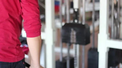 Young man is training arms Stock Footage 37201827