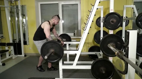 Young man training with the bars in the gym Stock Footage 74135732